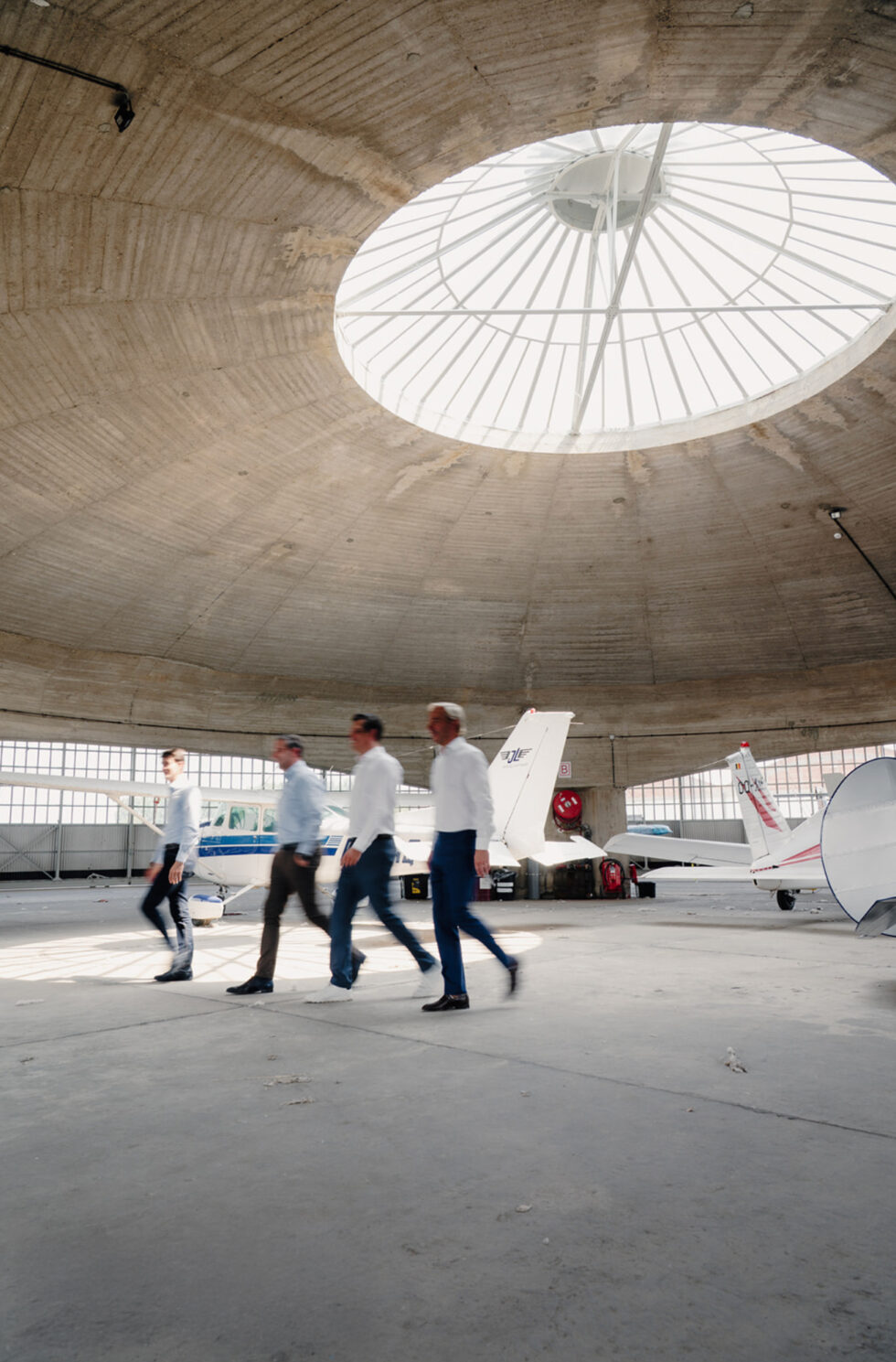 image of salaryman walking straight forward in a airport